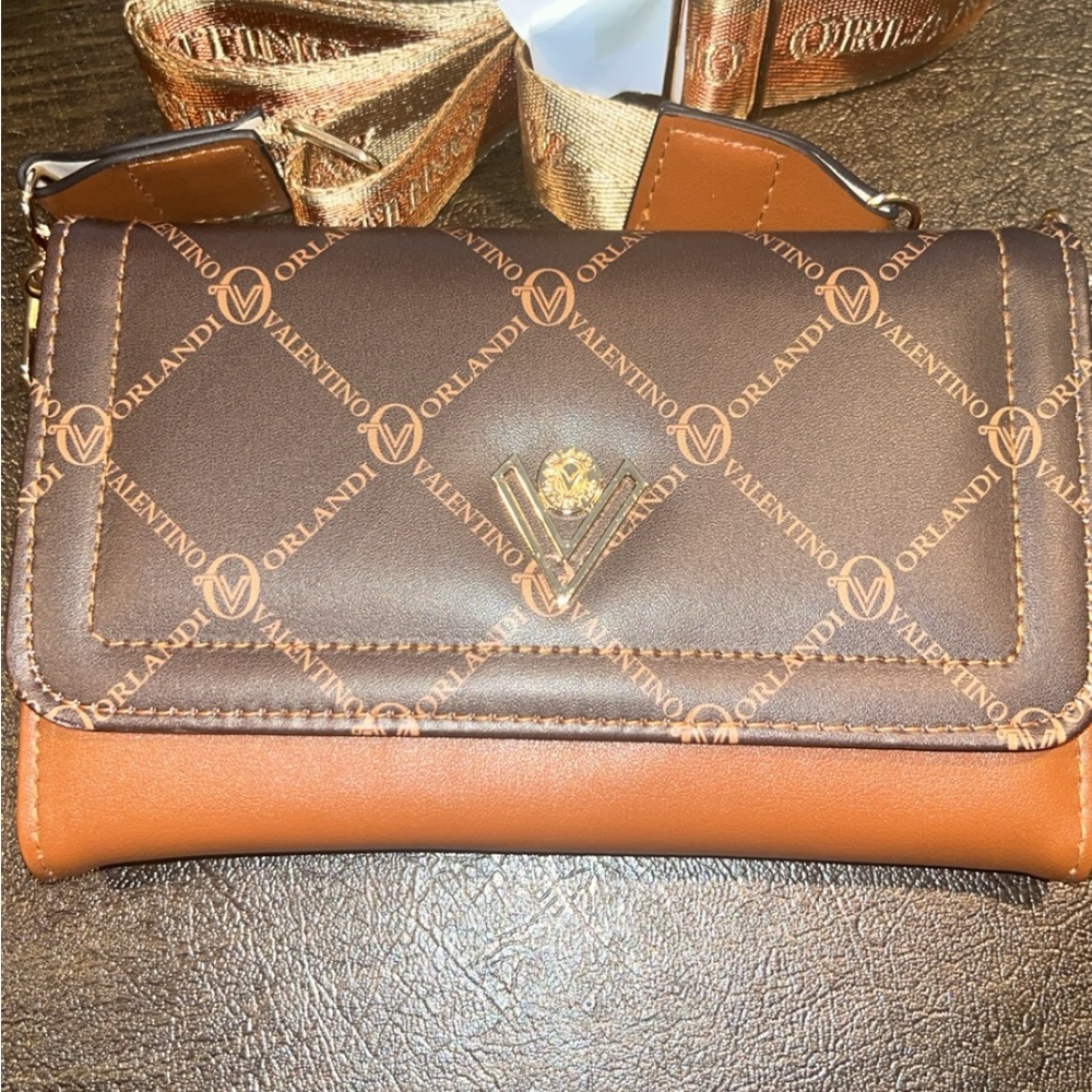 Beautiful cross body or clutch Valentino Orlando crossbody new with tags.